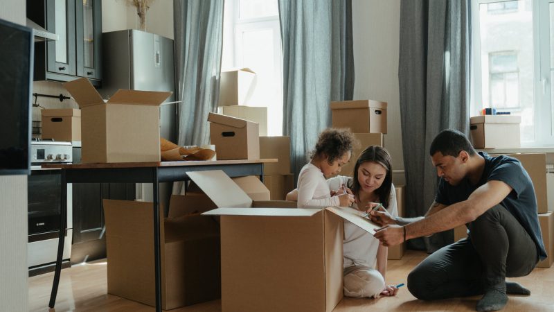 family unpacking after moving